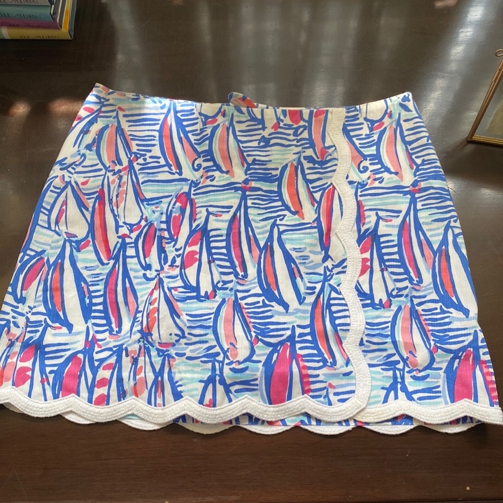 Lilly Pulitzer skirt. Colors are dark blue, light blue, pink and white. Size 0